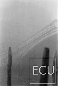 Black and white photo of the Scalzi bridge over the Grand Canal in winter in fog in Venice, Italy